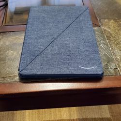 Amazon Kindle Fire HD 10, with denim case.