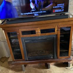 Tv Stand And Brown Leather Chair! Chair Has Small  Tear, This The Pretty Seat cover! $85.00 For Both! 