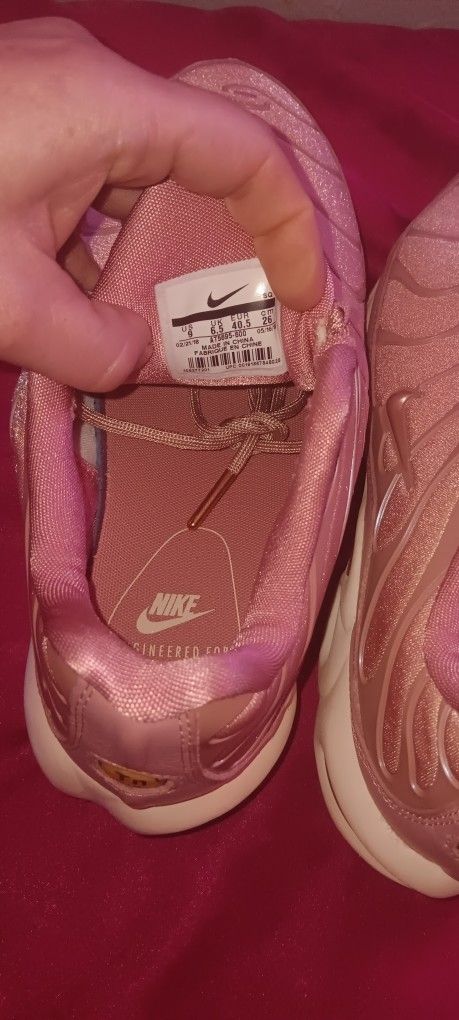 Nike Women's Air Max Plus sneakers in the Rust Pink color