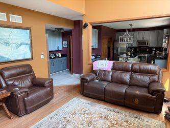 Leather 90” sofa power recliner & Oversidez