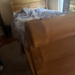 Trundle bed with mattresses , pine, good condition .