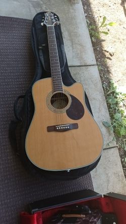 Acoustic Guitar With Amps And Surround Sound Speakers