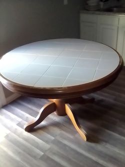 Round Pedestal Dining Table with Tile Top.