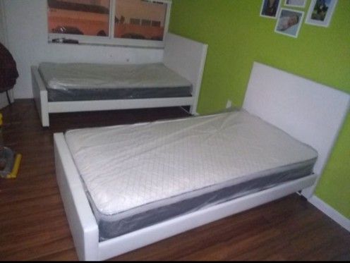 2 twin size bed frame new in the box with the mattress and free delivery and free set up