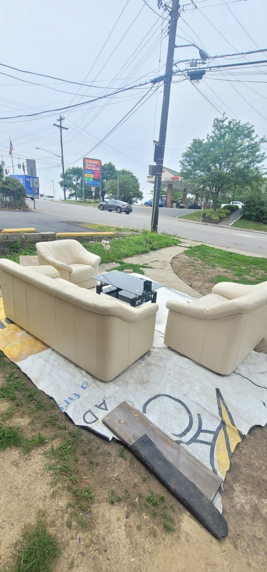 Leather sofa and loveseat and chair with black glass Coffee Table