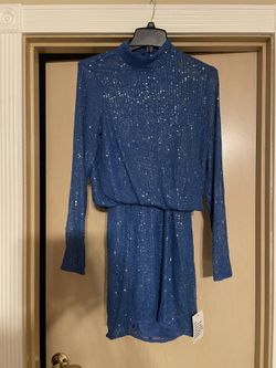 Beautiful brand new women’s size 6 fancy turquoise/blue sequin dress.  Open back  