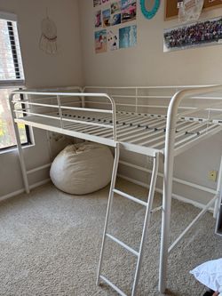 White metal loft bed with ladder