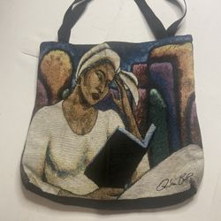 This is a woven tote bag featuring art by Asa B