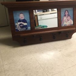 Small coat rack with mirror and two pictures