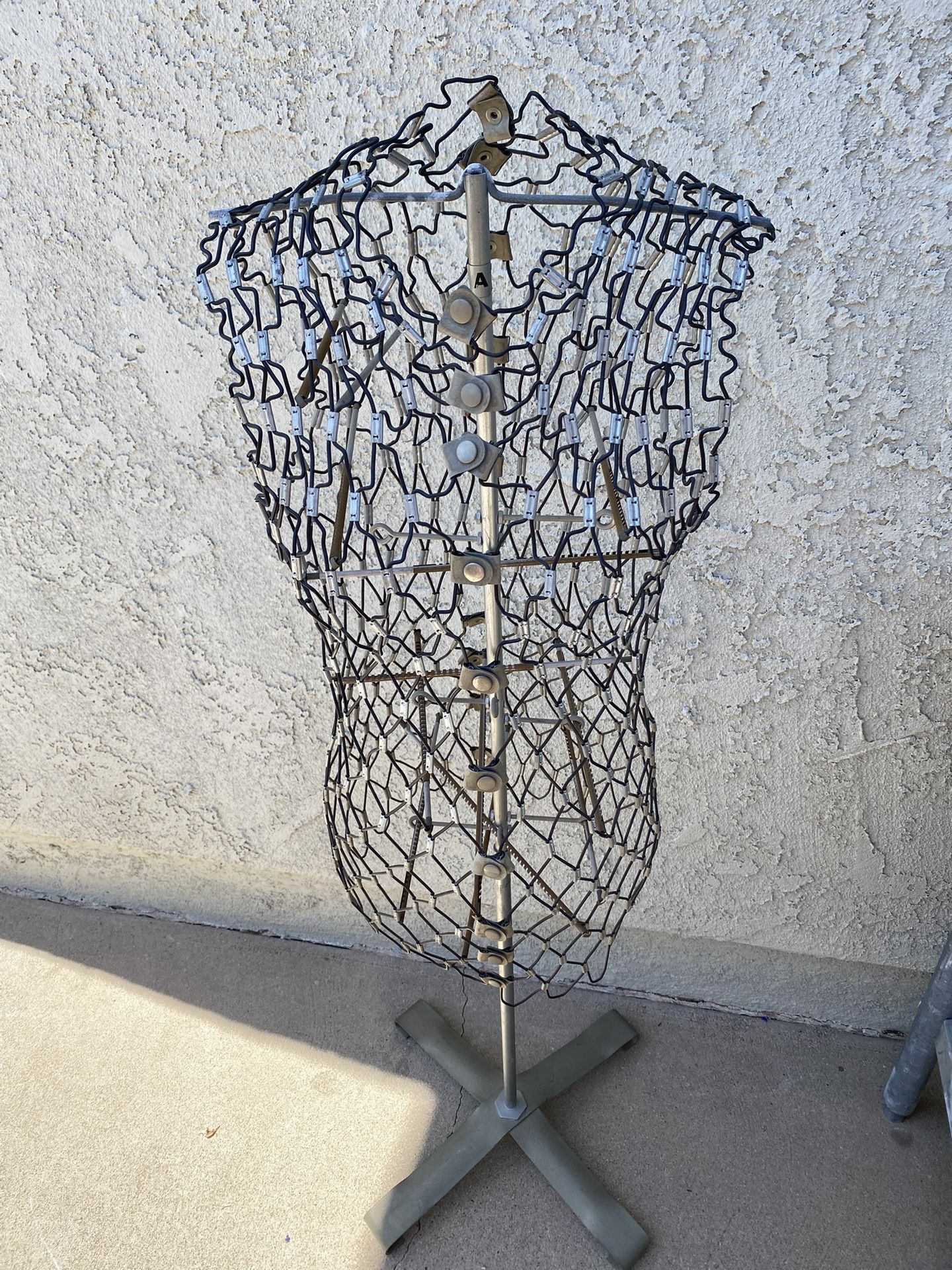 Antique dress form.