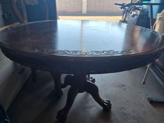 Round Wood Dining Table with Carved Details