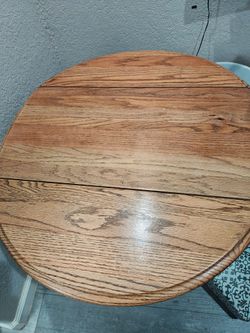 Double drop leaf small round table solid wood.