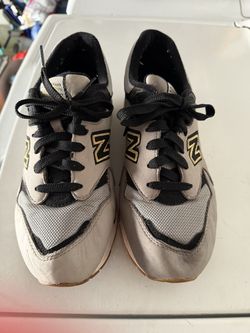 New Balance 1600 sneakers in the 'Grey Black Gold' colorway from the Lost World Collectio