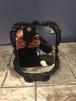 black makeup mirror