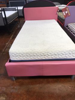 Brand new pink twin or full size bed with mattress