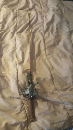 Old rod and reel. 42" long.