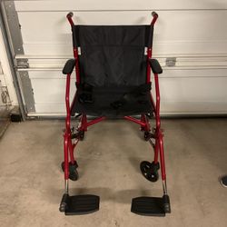 Red Medline lightweight transport wheelchair