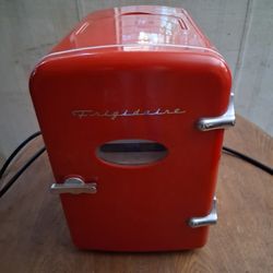 Mini Size Frigidaire Red 10 Inches Tall and 7 Inches Wide Good Condition Like New.
