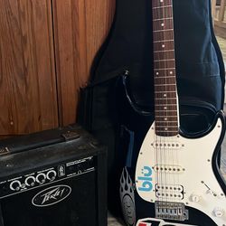 Amp And Cord With Electric Guitar With Case 