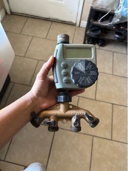 4-zone digital hose faucet timer with a brass 4-way manifold.
