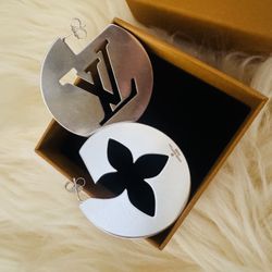 LV circles in a polished silver finish, with hollowed-out Monogram Flower design