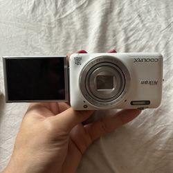 Nikon COOLPIX S6800 16.0MP Digital Selfie Camera White. It can take pictures like a selfie as well as a regular camera