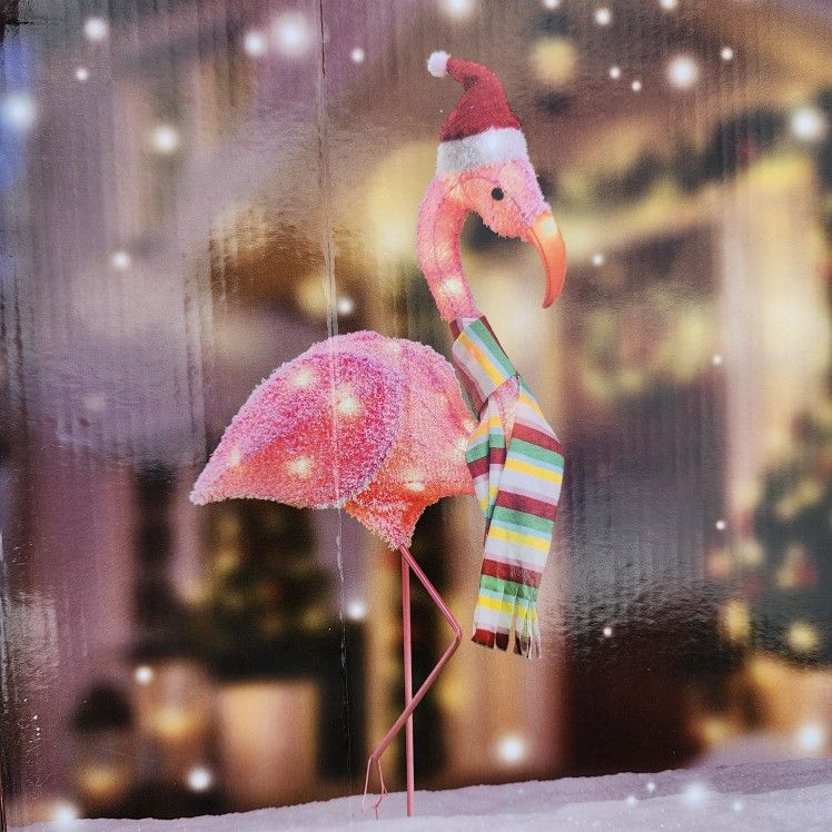 Holiday Time Light-Up Fluffy Christmas Flamingo decoration.
32-inch tall, pre-lit