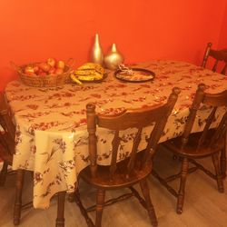 A dining table with 4 chairs