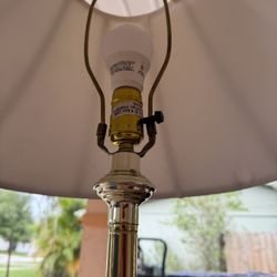 brass floor lamp with glass table