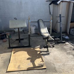 One bench press, and one curl bench and storage for the weights stand