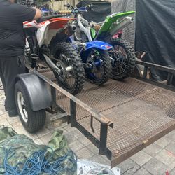 3 Dirt bikes And Trailer