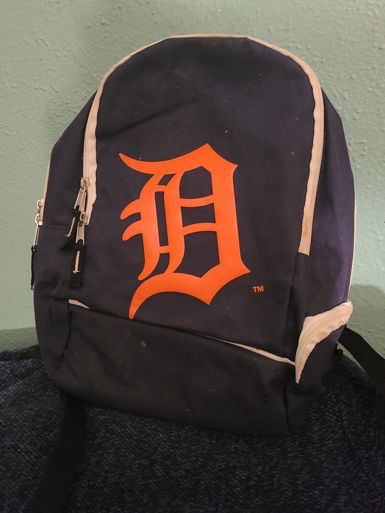 Detroit backpack 13" tall x 12" W 2 large zipper pockets, 1 small lower side pocket