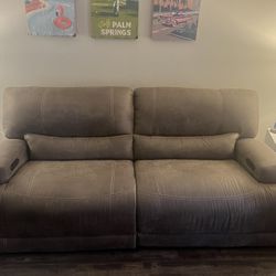 Brown power recliner with USB ports on both sides
