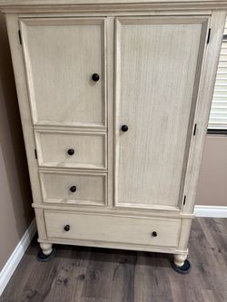 Cream Wood Armoire with Drawers From Ashely’s Furniture