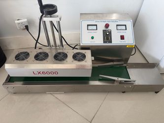 Induction sealing machine