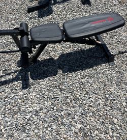 Adjustable weight bench with leg extension