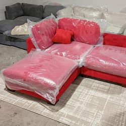Red corduroy 2 seater with ottoman.