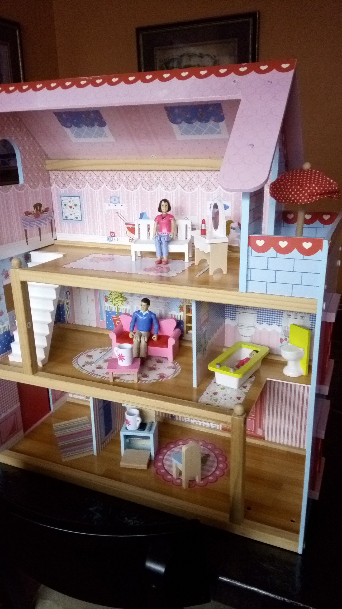 Kidkraft doll house with furniture and 3 articulated figures, dolls. 28" x 24" x 10"