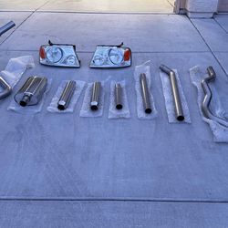 Ford F-150 aftermarket exhaust system (full kit with muffler + pipes) + headlights. Clean condition
