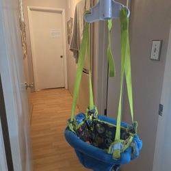 Evenflo ExerSaucer Blue and Green Baby Doorway Jumper. Baby Jumper.