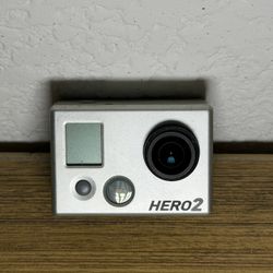 GoPro HERO2 Silver Action Camera  Compact GoPro HERO2 with durable build. Ideal for capturing adventures.  Comes with the a water proof case. Cables a