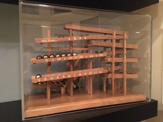 One of the rarest wooden ball clock this is not plastic.