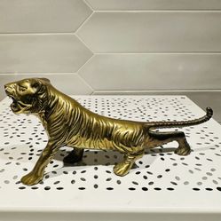 Vintage Taiwan solid brass tiger figurine 7” long x 3” tall   Has normal vintage patina and has not been polished Has original foil sticker 