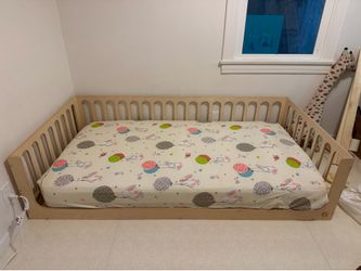 Brand NEW- Montoddler floor bed frame in twin size!