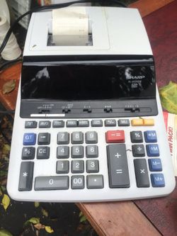 Sharp calculator with paper