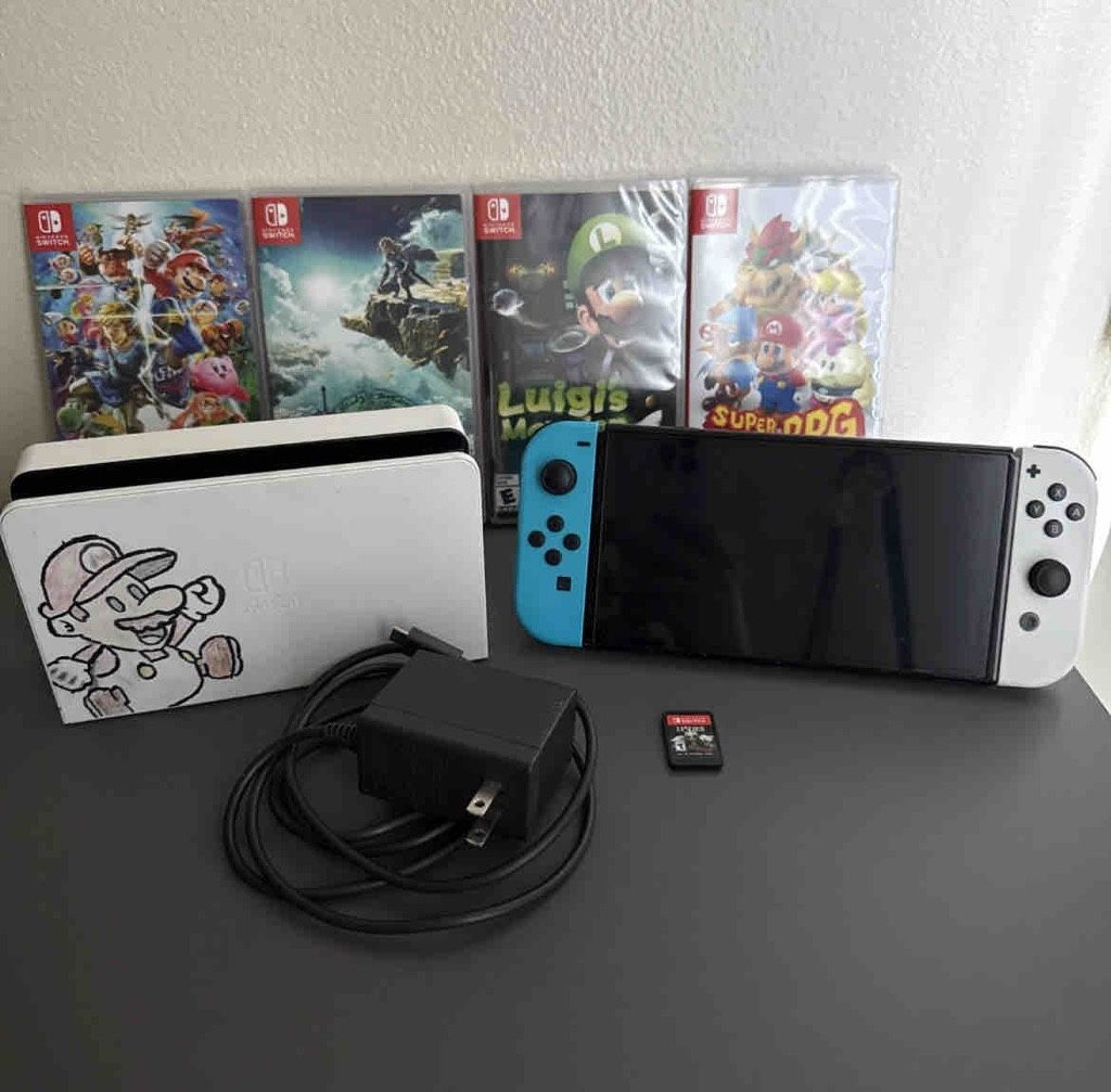 SWITCH OLES CONDOLE BUNDLE WITH 4 GAMES AND ACCESSORIES