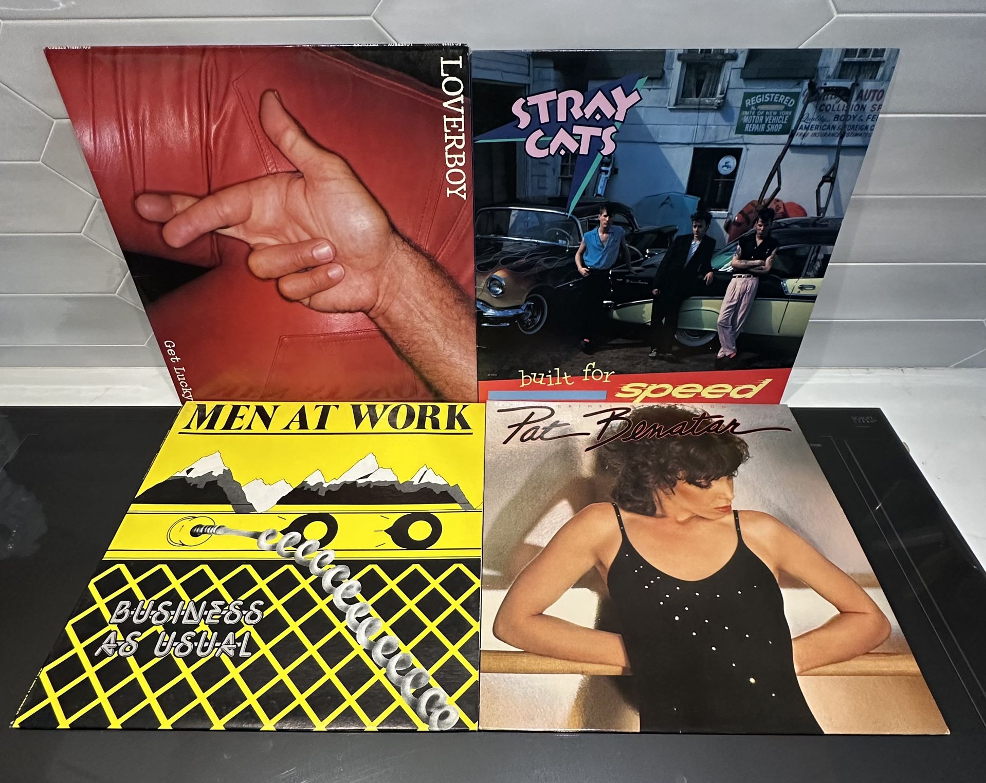 80s vintage vinyl 4 albums $20 for all. Great graphics. Pat benatar, men at work, stray cats and loverboy.