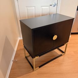 Black Storage Cabinet with Gold Base
