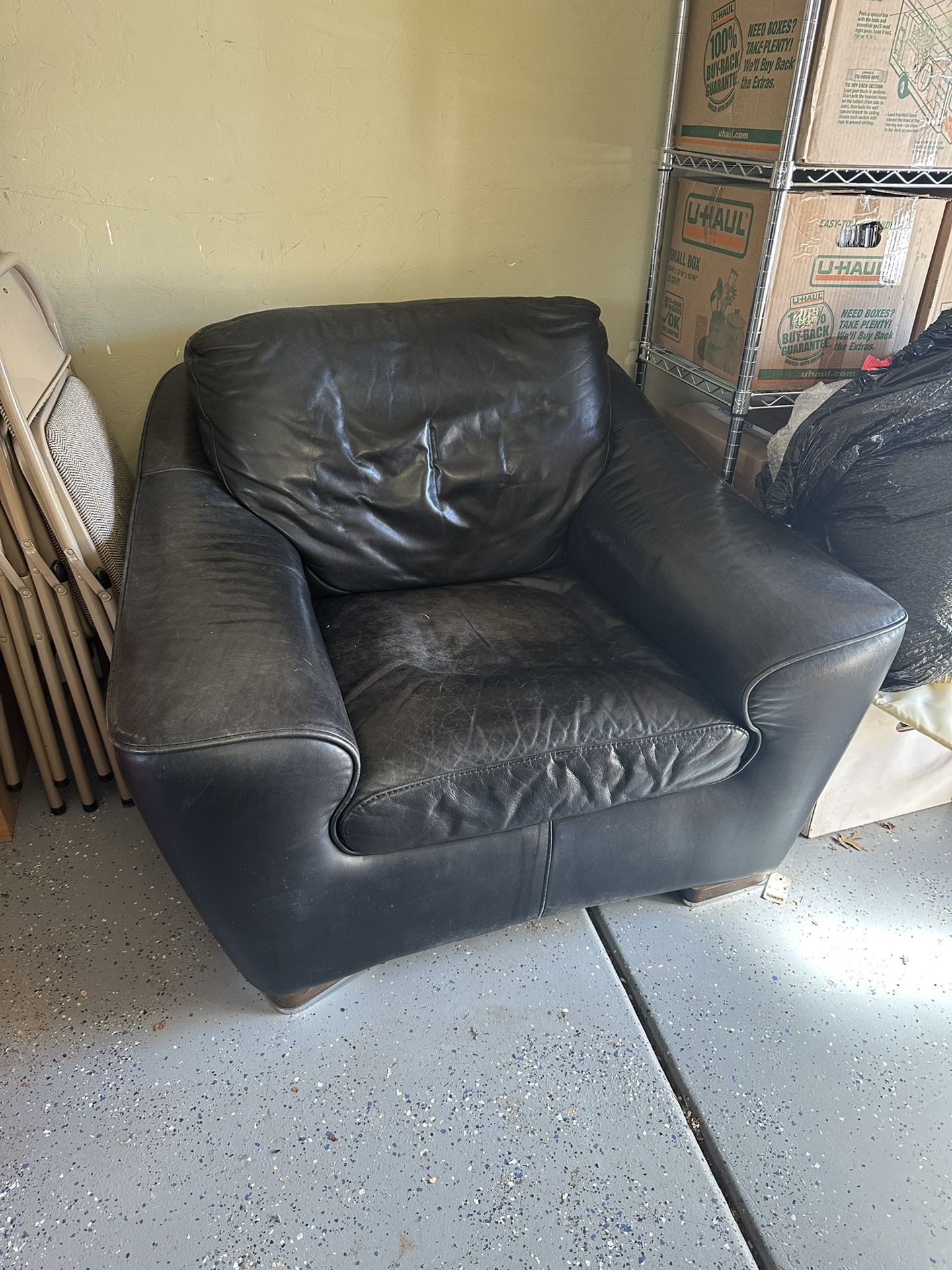 Black Leather Armchair & Ottoman