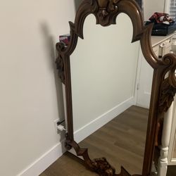 Ornate carved wood frame mirror in Victorian Revival style by Maitland Smith.